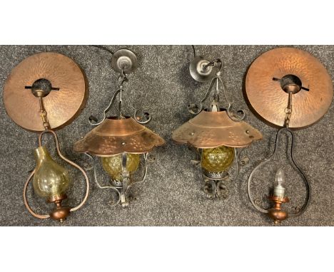 Lighting - A pair of wrought iron, copper and glass, Arts and Crafts style pendant ceiling lights, each 55cm high;  another p