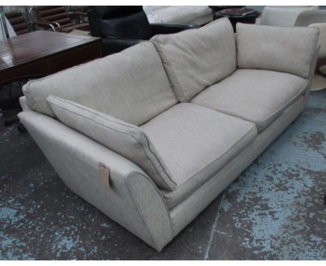 SOFA, two seater in neutral fabric on castors, 227cm L.