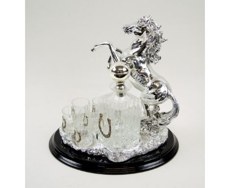 LIQUOR SET BY CHINELLI, silvered metal of rearing horse form with glass decanter and six glasses, retailed by Harrods, stand 