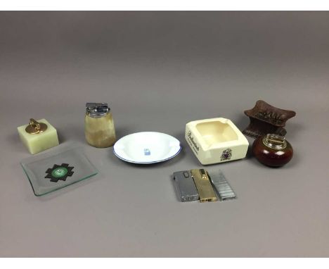 SMOKING INTEREST GROUP,including a Ronson bakelite Safety Ashtray, a Colibri Monopol table lighter, a horn table lighter, thr