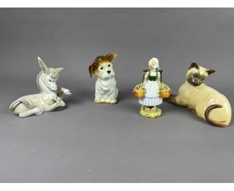 LLADRO GROUP OF A BOY AND DOG,18cm high, along with a Lladro figure of a boy with an accordion, a Lladro figure of a donkey, 