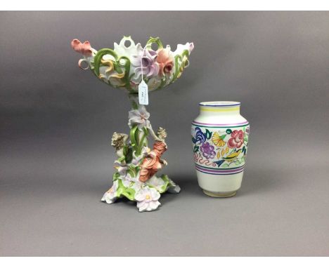 POOLE VASE,23cm high, with floral decoration and a continental figural table centrepiece (2)