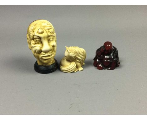CHINESE NOVELTY RESIN HEAD STUDY,formed from multiple persons, character marks to base, 8cm high, along with two resin netsuk