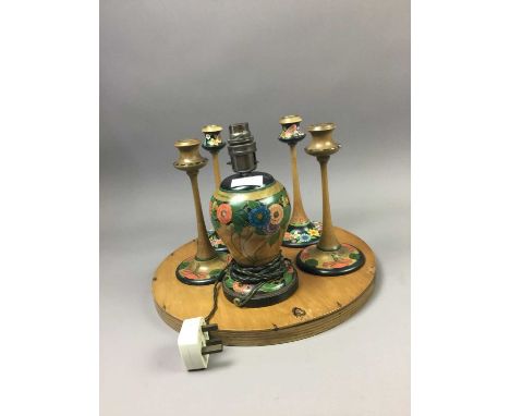 ART DECO WALL MIRROR,in a frame painted with flowers and a butterfly, along with two pairs of painted wood candlesticks and a