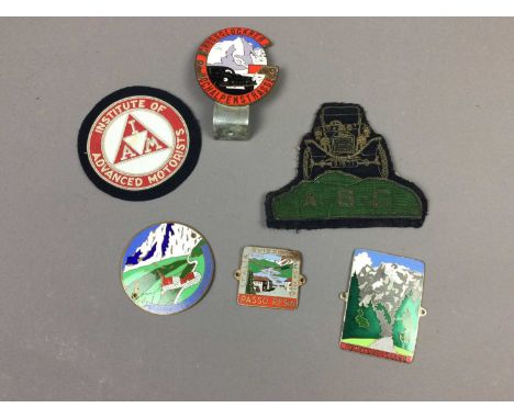 FOUR ENAMEL AUTOMOBILE BADGES,along with two wirework pocket patches (6)