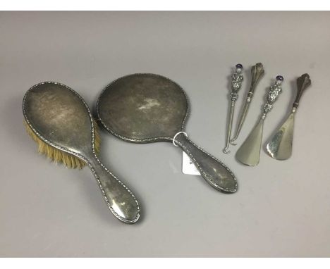 SILVER HAND MIRROR AND BRUSH,along with two button hook and shoe horn sets