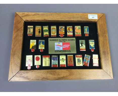 COCA COLA OLYMPIC GAMES ENAMEL BADGES,circa 1896 to 1992, in a presentation frame, 26.5cm x 37cm overall