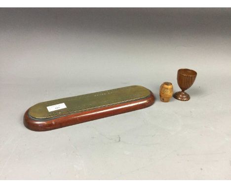 SMALL 19TH CENTURY BARREL SHAPED NUTMEG GRATER,along with treen egg cup and a wood and brass cribbage board (3)