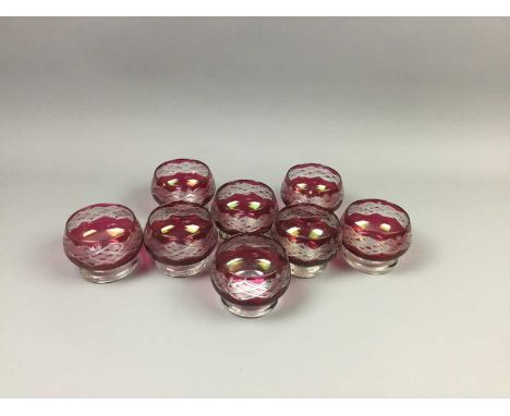 SET OF EIGHT CRANBERRY GLASS DESSERT BOWLS,with etched detail on spreading feet, 9cm wide eachCondition report: Internal diam