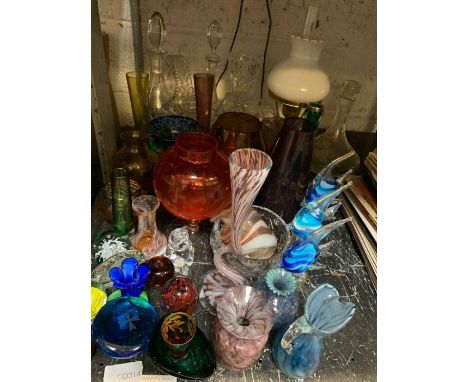 Half shelf of glass, decanters, glass baskets, vases, oil lamp, coloured fish ornaments etc condition requests and additional