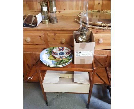 Wooden trolley, plates, oil lamp etc, condition requests and additional images will not be given for lots in this sale.