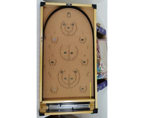 Box containing a bagatelle board, games and bygone items