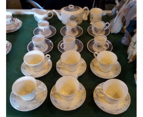 A Susie Cooper Glen Mist pattern tea set, comprising: six cups and saucers, teapot, sugar bowl and milk jug, together with a 