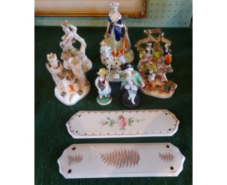 A quantity of 19th century and later Staffordshire flatback figurines and others, together with two hand painted ceramic door