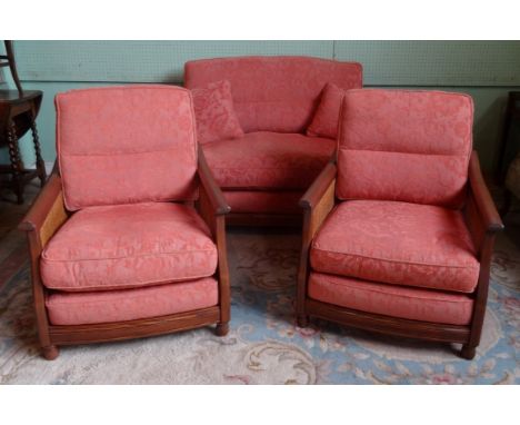 A contemporary single cane three piece bergere suite, comprising two seater sofa and two armchairs.