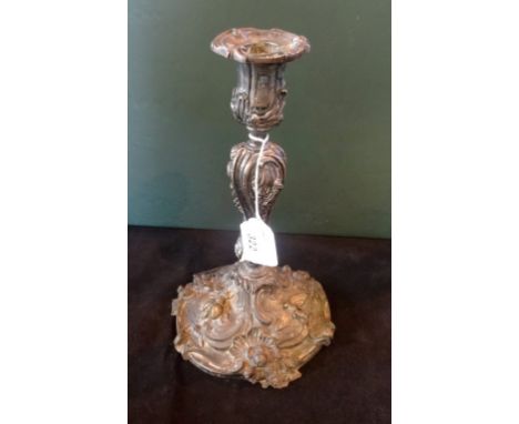 An impressive white metal candlestick, late 19th/early 20th century, the circular base decorated with applied moss and insect