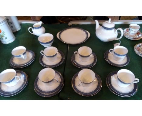 A Royal Doulton Sherbrooke pattern tea service H5009, comprising: eight trios, a teapot, cake plate, sugar bowl and milk jug.