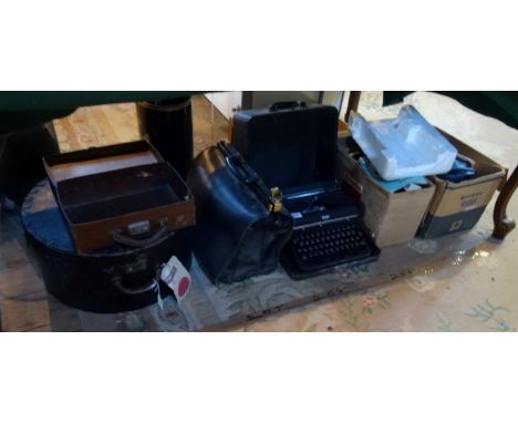 A mixed lot to include: a small brown leather suitcase, leather hat box, a Royal typewriter, a Sankyo Dualux 1000 cine projec