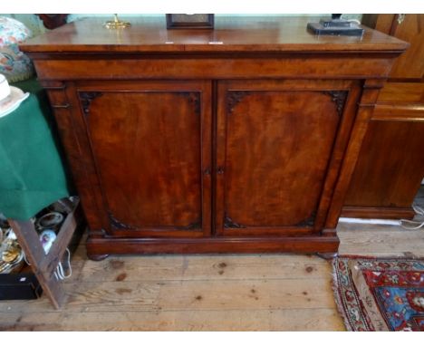 A Victorian mahogany two door cabinet, having four internal graduated drawers beside open shelf over large drawer, the whole 