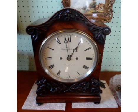 A Victorian mahogany double fusee repeating bracket clock, the scrolled top over an enamel dial bearing Roman numerals, signe
