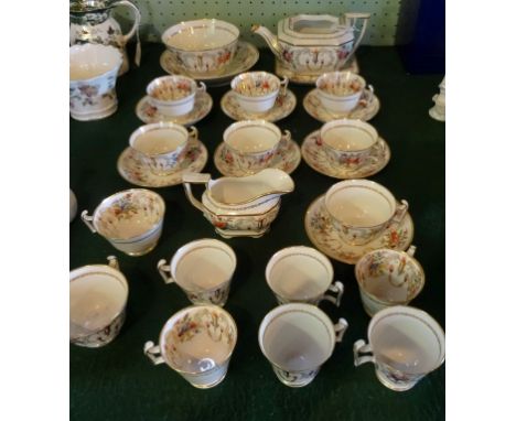 A collection of 19th century Spode teawares, pattern no. 2777, having hand painted floral sprays and gilt swags on an ivory g