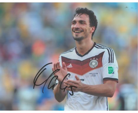 Football. Mats Hummels Signed 10 x 8 inch Colour Photo Showing Mats Hummels Applauding While Playing for Germany National Tea