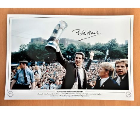 Football, Bobby Moncur signed 12x18 colour photograph pictured as he holds the 1969 Fairs Cup in front of adoring fans outsid