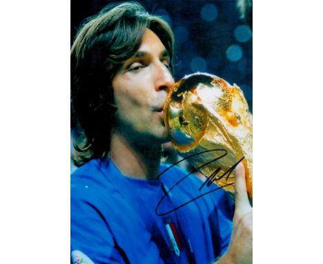 Football Andrea Pirlo signed 12x8 colour photo pictured with the World Cup Trophy while playing for Italy. Good condition. Al