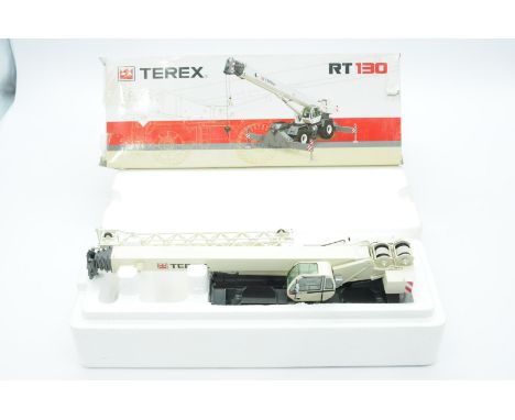 NZG a boxed 1:50 Scale No.764 RT130 Rough Terrain Crane "TEREX". Condition is Near Mint (unchecked for completeness) in Fair 