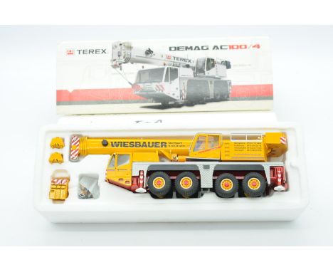 Conrad a boxed 1:50 Scale No.2104/0 Demag AC100/4 All-Terrain Crane "WIESBAUER". Condition is Excellent Plus to Near Mint (un