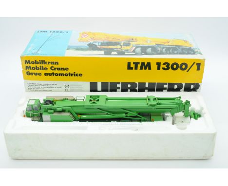 Conrad a boxed 1:50 Scale No.2097/0 LTM 1300/1 Mobile Crane, believed to be "JAMES JACK" Code 3 model. Condition is generally