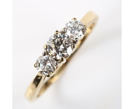 A modern 14ct gold three stone diamond ring, set with modern round brilliant-cut diamonds, total diamond content approx 0.65c