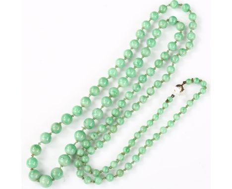 A single-strand graduated jade bead necklace, individually knotted, bead diameters 8.7mm - 4.5mm, necklace length 86cm, 51.1g