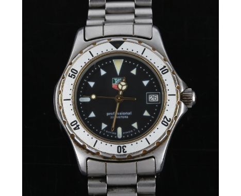TAG HEUER - a stainless steel 2000 Professional 200M quartz bracelet watch, ref. 974.013B, black dial with luminous arrowhead