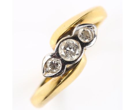 A modern 18ct gold three stone diamond crossover ring, set with modern round brilliant-cut diamonds, total diamond content ap