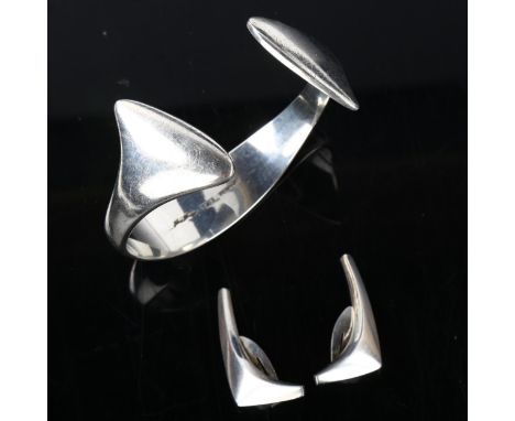 2 pieces of Danish sterling silver modernist jewellery, comprising Hans Hansen torque bangle and Anton Michelsen clip-on earr