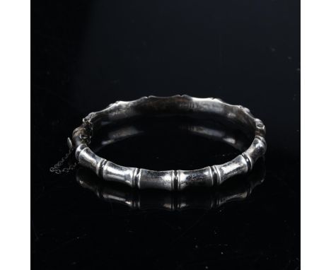 A mid-20th century silver simulated bamboo hinged bangle, maker's marks CM, hallmarks Birmingham 1966, band width 7.8mm, inte