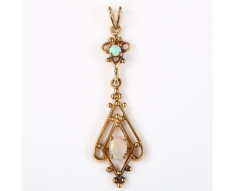 An Edwardian style opal openwork pendant, unmarked gold settings with cabochon opals, pendant height 54.5mm, 3.3g 