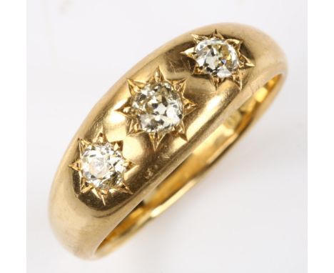 An early 20th century 18ct gold three stone diamond gypsy ring, set with old European-cut diamonds, total diamond content app