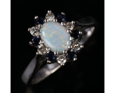 A late 20th century 18ct white gold opal sapphire and diamond cluster ring, set with oval cabochon opal and round-cut sapphir