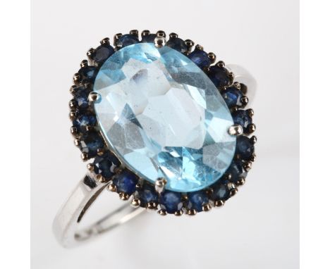 A modern 9ct white gold blue topaz and sapphire cluster ring, setting height 18mm, size R, 4.6g 