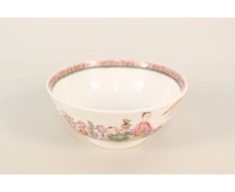 A Lowestoft bowl, enamels with Chinese lady and boy sat in a garden with fence and squirrel, cell internal border with green 