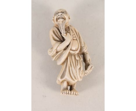 A 19th Century porcelain Hirado netsuke of a Sennin, signed Masakazu