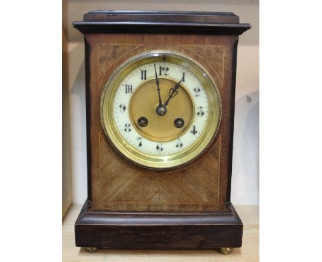 An Edwardian inlaid mahogany mantel clock