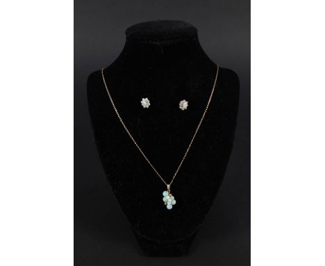 A 9ct gold opal and diamond set drop pendant on chain, clasp stamped 750 with similar 9ct gold opal earrings