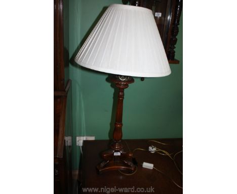 An elegant contemporary hardwood Table Lamp having three splay leg base, turned and fluted pillar with crown pediment and wit