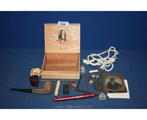 Miscellaneous items to include; enamelled badges, penknives, a pipe, a whistle, etc.