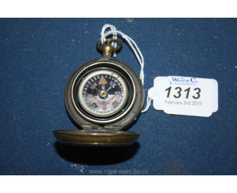 An old brass cased Pocket Compass with luminous face by Negretti and Zambra, London