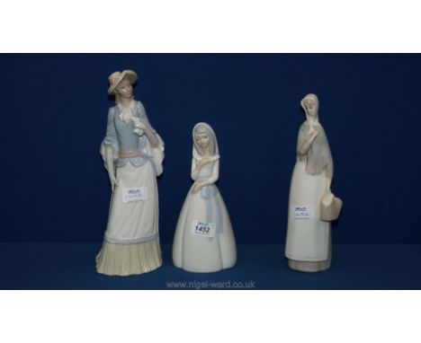 A Spanish figurine of a Lladro style lady along with a Tang model of a lady carrying a basket, plus another one.