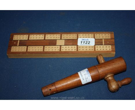 An inlaid cribbage Board, complete with pegs; manufactured by K &amp; C London, plus a 20th c. wooden cask tap.
